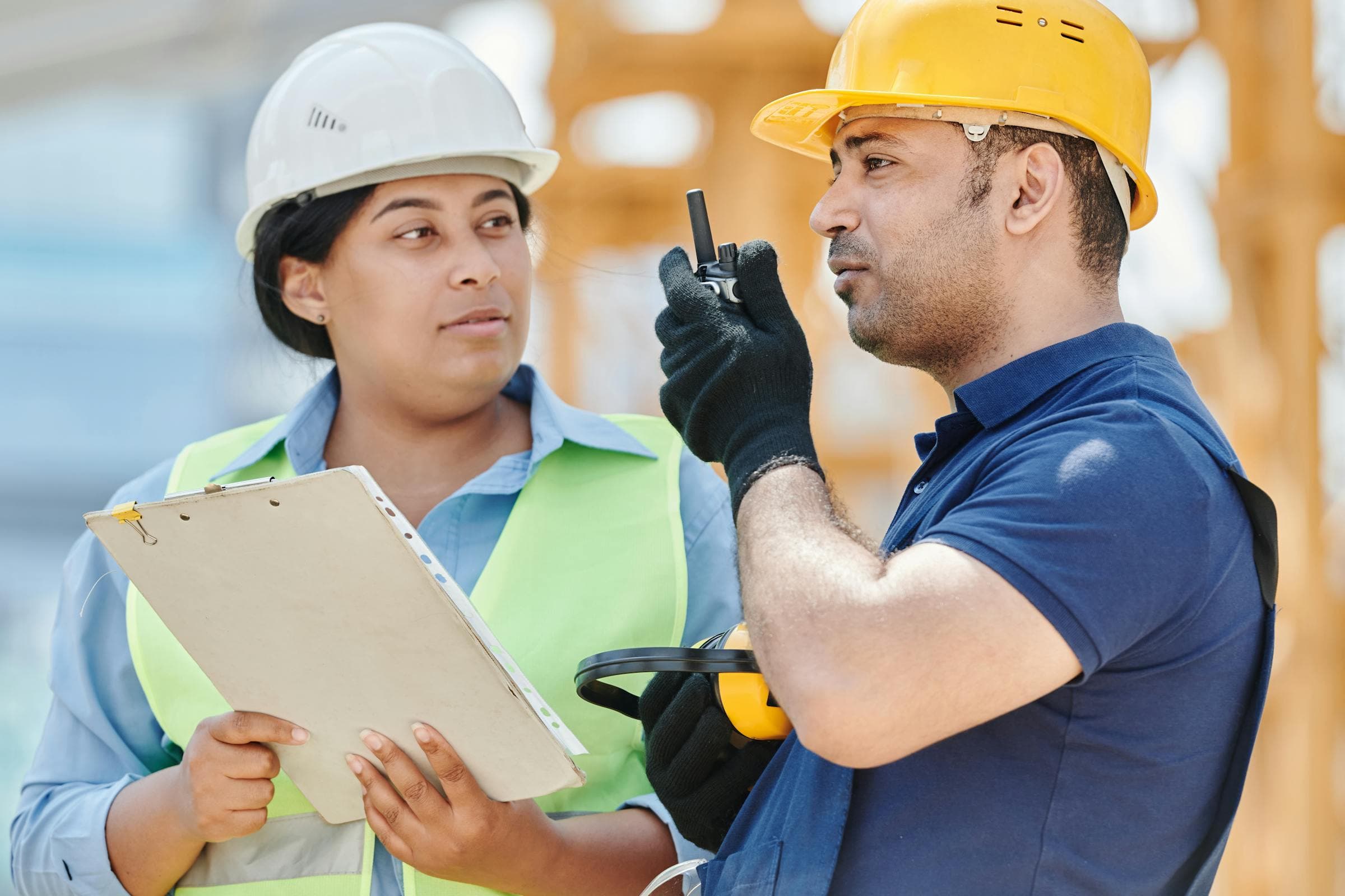 Construction professionals reviewing plans on site